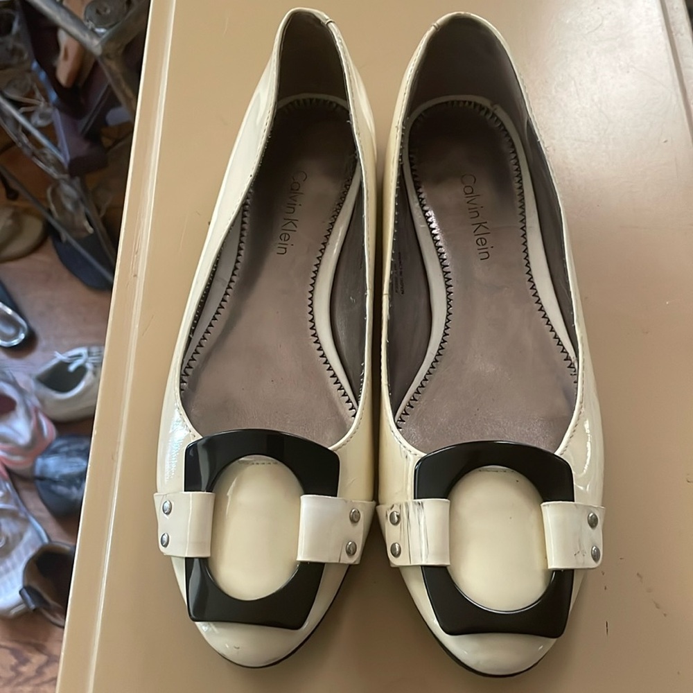 White Calvin Klein flats